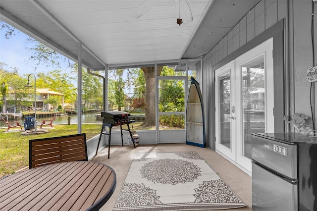 5421 Gay St, Weeki Wachee, FL 34607 - sunroom / solarium with a water view and a ceiling fan