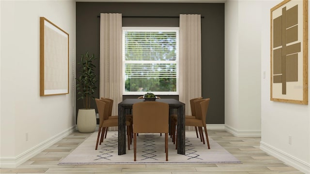 6905 E 116th Ct, Palmetto, FL 34221 - dining space featuring light wood-style floors and baseboards