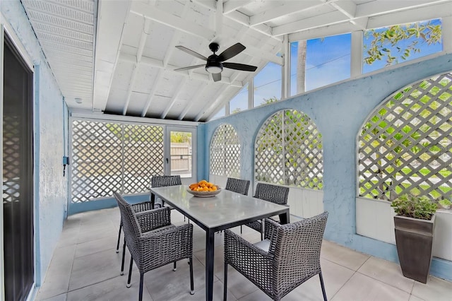 sunroom featuring outdoor dining space and ceiling fan