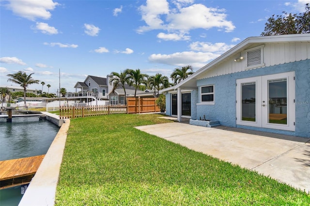 view of yard featuring french doors and a patio