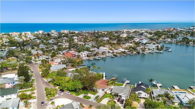 aerial perspective of suburban area with a large body of water