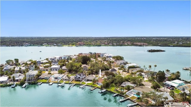 aerial view of residential area with a nearby body of water