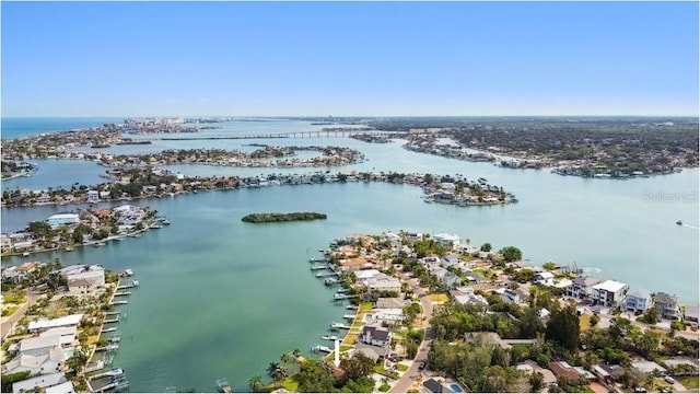 aerial perspective of suburban area with a large body of water and a marina