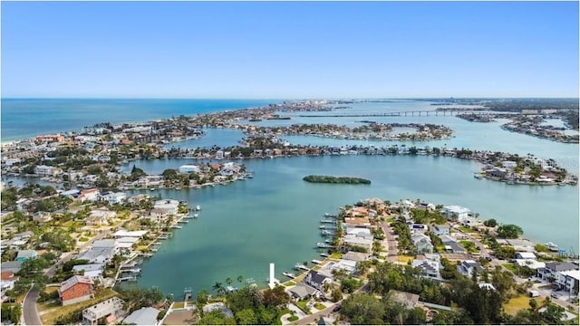 aerial view of residential area featuring a nearby body of water
