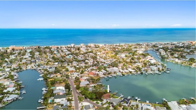 view of property location with a large body of water and nearby suburban area