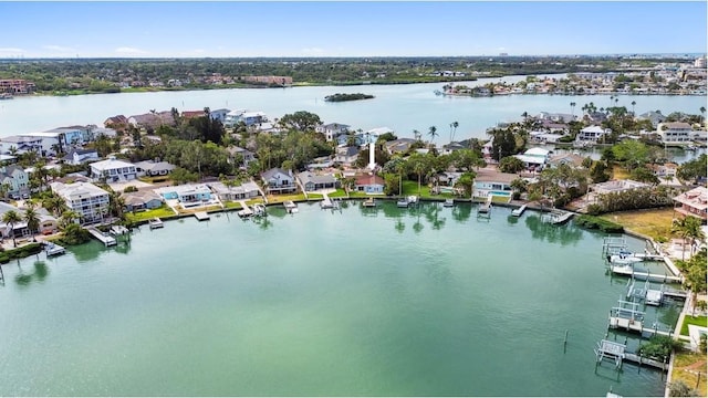 aerial perspective of suburban area with a large body of water