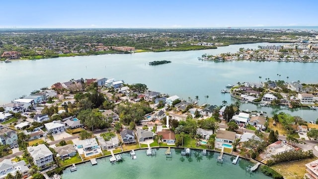 aerial overview of property's location with a nearby body of water and nearby suburban area