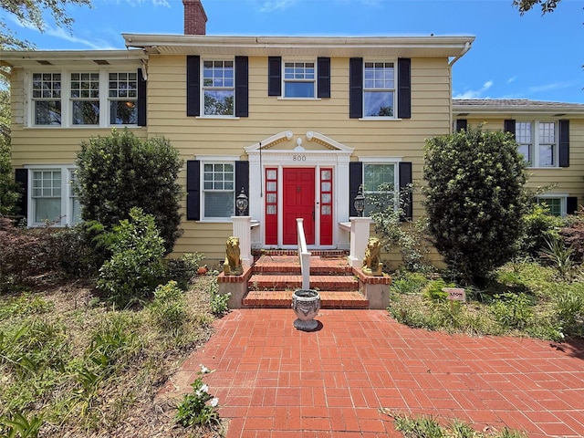 800 W Lake Elbert Dr NE, Winter Haven, FL 33881 - colonial-style house with a chimney