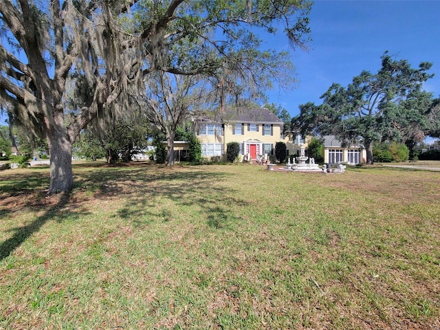 800 W Lake Elbert Dr NE, Winter Haven, FL 33881 - view of green lawn with a patio