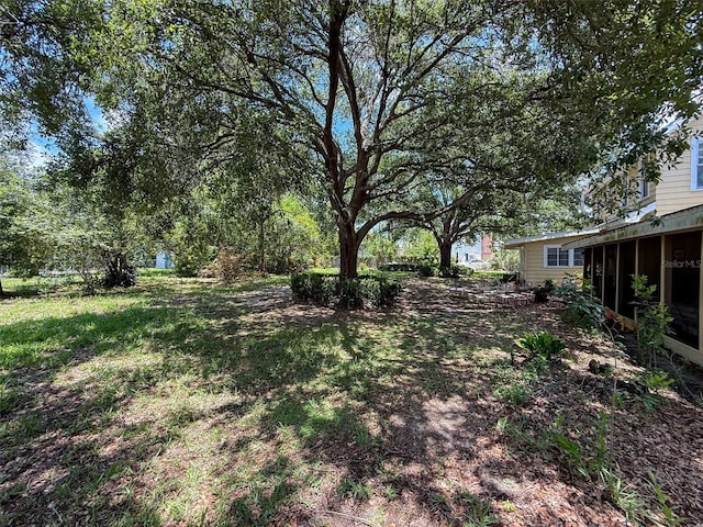 800 W Lake Elbert Dr NE, Winter Haven, FL 33881 - view of yard with a sunroom