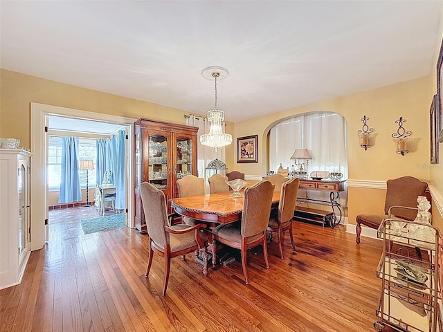 800 W Lake Elbert Dr NE, Winter Haven, FL 33881 - dining space featuring light wood-style flooring and a chandelier