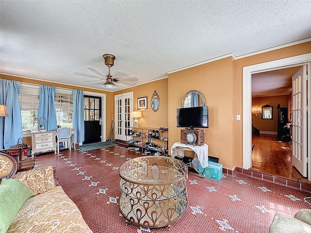 800 W Lake Elbert Dr NE, Winter Haven, FL 33881 - living room with french doors, ornamental molding, a ceiling fan, and a textured ceiling