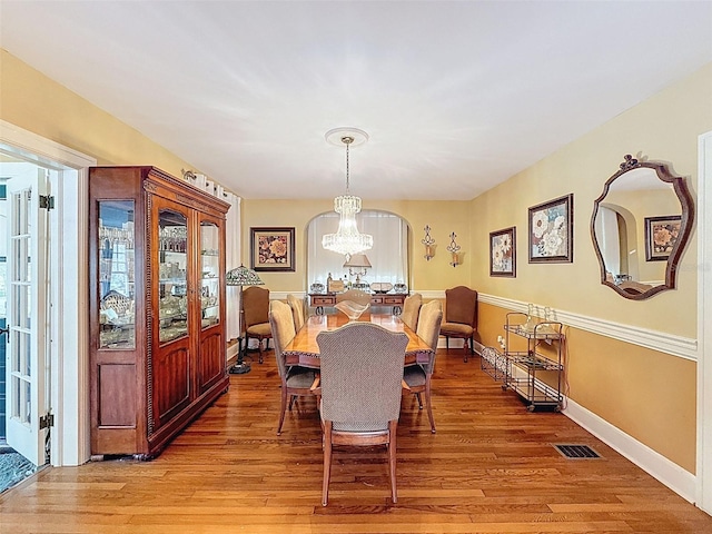 800 W Lake Elbert Dr NE, Winter Haven, FL 33881 - dining space with light wood-style floors, plenty of natural light, and a chandelier