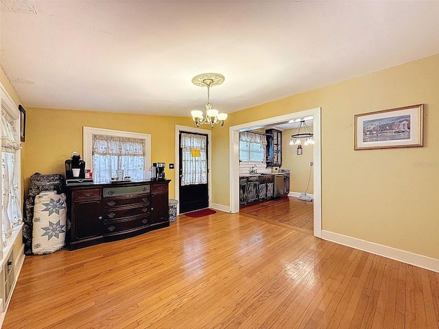 800 W Lake Elbert Dr NE, Winter Haven, FL 33881 - dining space featuring a chandelier and light wood-style flooring