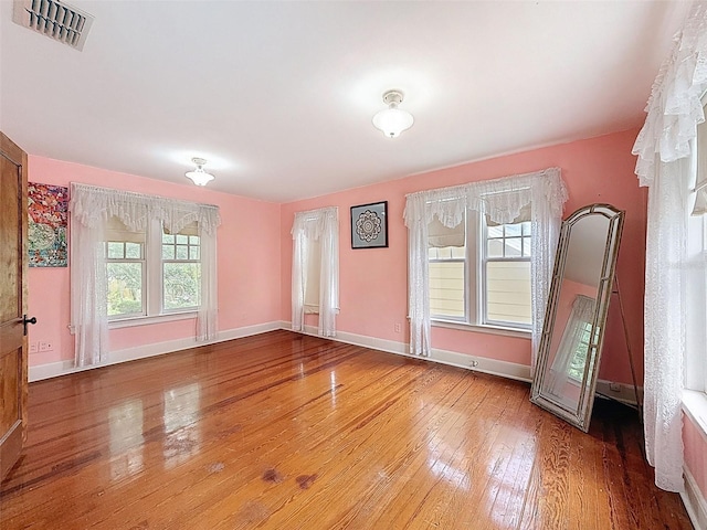 800 W Lake Elbert Dr NE, Winter Haven, FL 33881 - empty room with hardwood / wood-style floors and baseboards