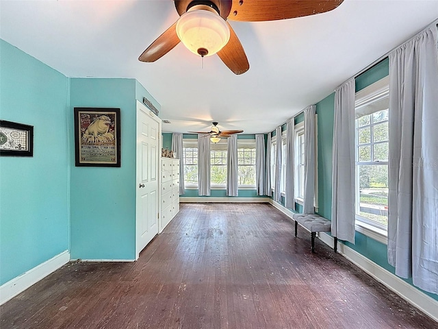 800 W Lake Elbert Dr NE, Winter Haven, FL 33881 - unfurnished sunroom featuring baseboards and wood finished floors