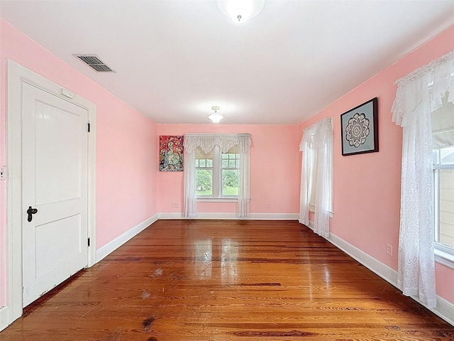 800 W Lake Elbert Dr NE, Winter Haven, FL 33881 - empty room featuring wood finished floors and baseboards