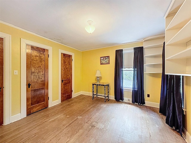 800 W Lake Elbert Dr NE, Winter Haven, FL 33881 - unfurnished room featuring wood finished floors and ornamental molding