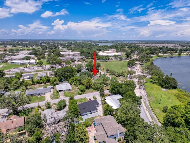 800 W Lake Elbert Dr NE, Winter Haven, FL 33881 - aerial overview of property's location with a nearby body of water and a tree filled landscape