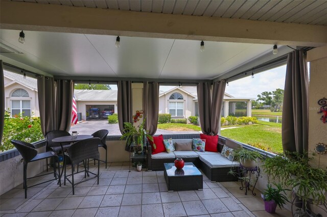view of patio / terrace featuring a water view and outdoor lounge area