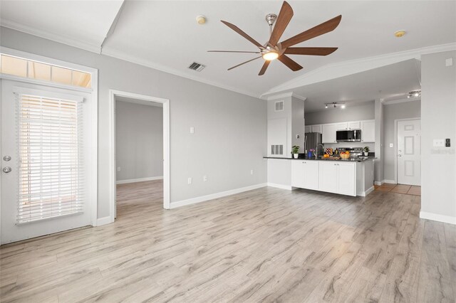 5000 Culbreath Key Way Unit 8-319, Tampa, FL 33611 - living area featuring ceiling fan, crown molding, light wood finished floors, and baseboards