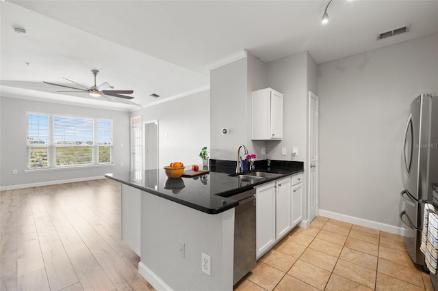 5000 Culbreath Key Way Unit 8-319, Tampa, FL 33611 - kitchen with stainless steel appliances, a peninsula, white cabinets, open floor plan, and crown molding