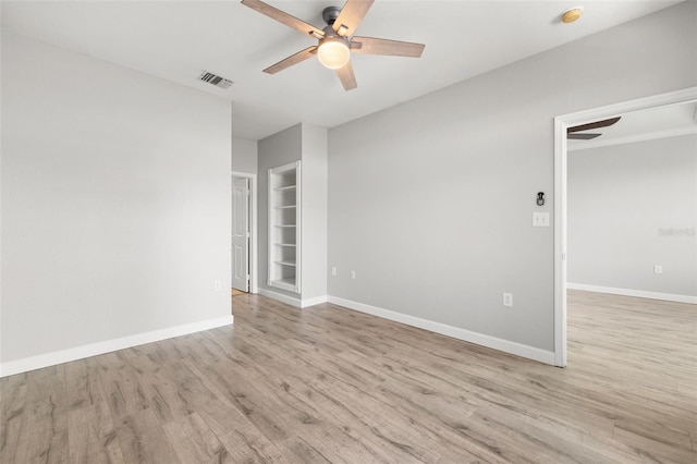 5000 Culbreath Key Way Unit 8-319, Tampa, FL 33611 - empty room with ceiling fan, wood finished floors, baseboards, built in features, and a smoke detector
