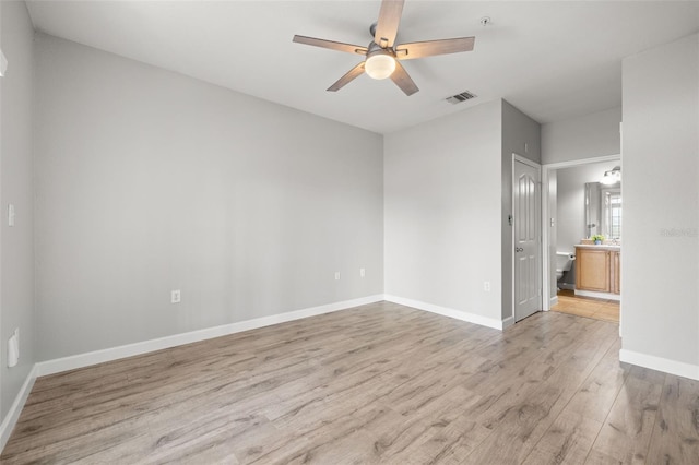 5000 Culbreath Key Way Unit 8-319, Tampa, FL 33611 - empty room with a ceiling fan, light wood finished floors, baseboards, and fire sprinkler in ceiling