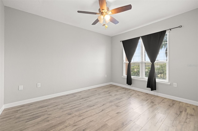 5000 Culbreath Key Way Unit 8-319, Tampa, FL 33611 - unfurnished room featuring light wood finished floors, baseboards, and ceiling fan