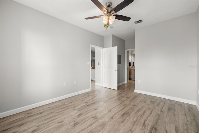 5000 Culbreath Key Way Unit 8-319, Tampa, FL 33611 - empty room featuring light wood-type flooring, baseboards, a ceiling fan, and electric panel