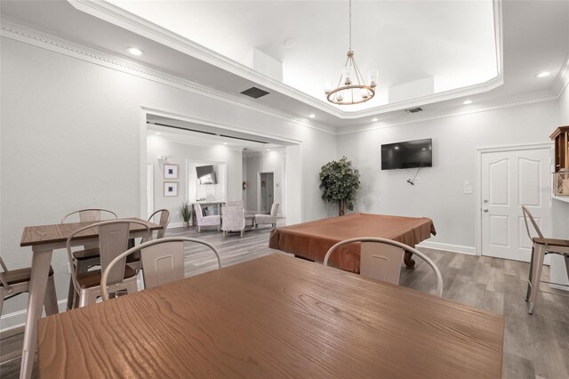 5000 Culbreath Key Way Unit 8-319, Tampa, FL 33611 - dining area with wood finished floors, a chandelier, crown molding, recessed lighting, and baseboards