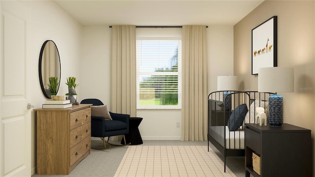 sitting room featuring light carpet and baseboards