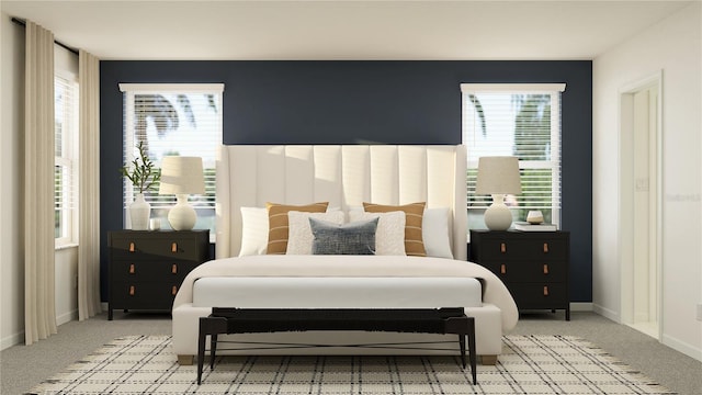 bedroom with baseboards and light colored carpet