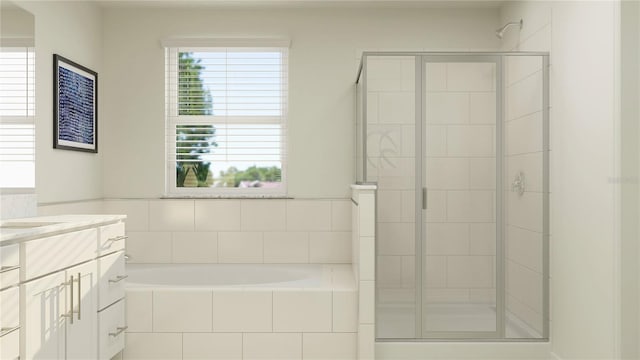 full bath with a stall shower, vanity, and a garden tub