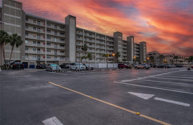 parking at dusk featuring uncovered parking