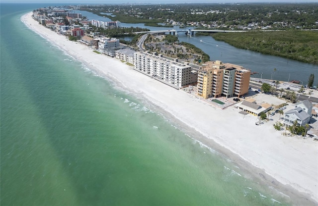 birds eye view of property featuring a view of the beach and a water view