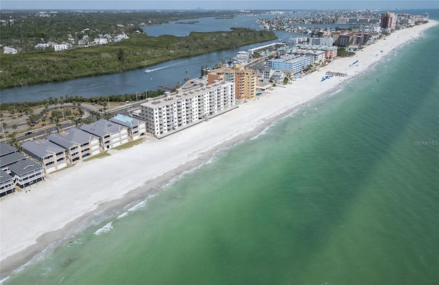 birds eye view of property featuring a water view and a view of the beach