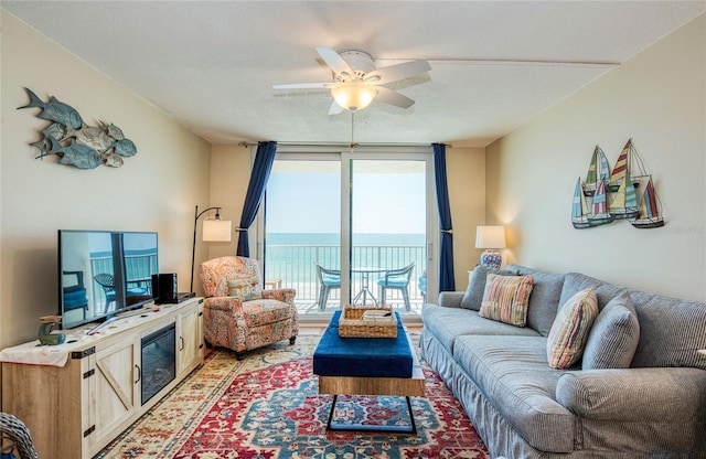 living area with a ceiling fan