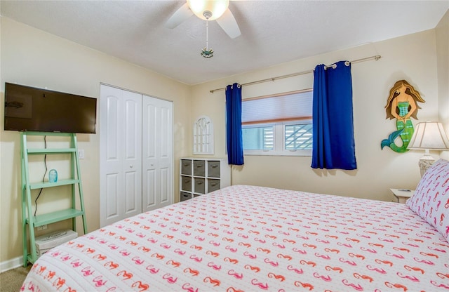 bedroom featuring a closet, ceiling fan, and carpet floors