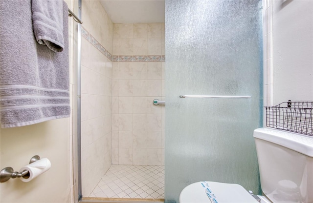 full bath with a stall shower and toilet