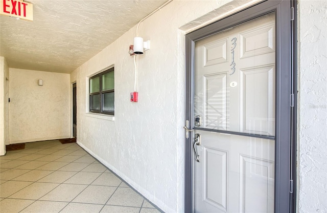 property entrance with stucco siding