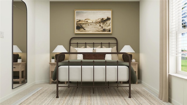 bedroom with carpet flooring and baseboards