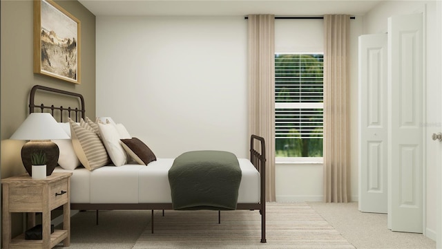carpeted bedroom featuring baseboards