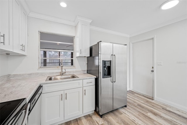 kitchen featuring a sink, stainless steel appliances, crown molding, white cabinetry, and light countertops