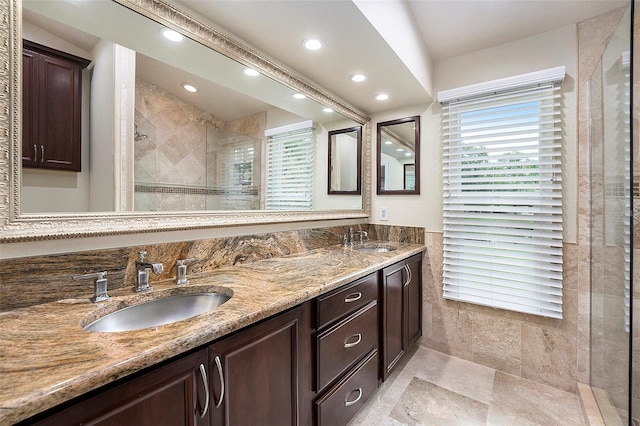 3268 Tanglewood Trl, Palm Harbor, FL 34685 - bathroom with a stall shower, plenty of natural light, recessed lighting, and double vanity