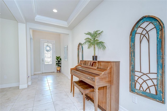 entrance foyer featuring baseboards, a tray ceiling, crown molding, light tile patterned flooring, and recessed lighting