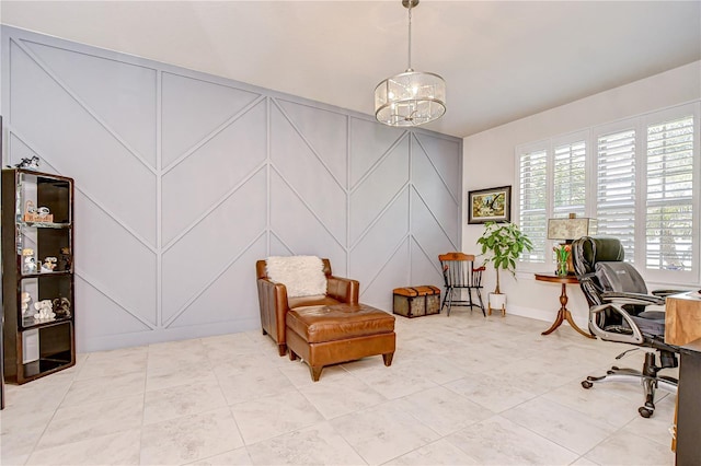 tiled office with a decorative wall, a chandelier, and baseboards