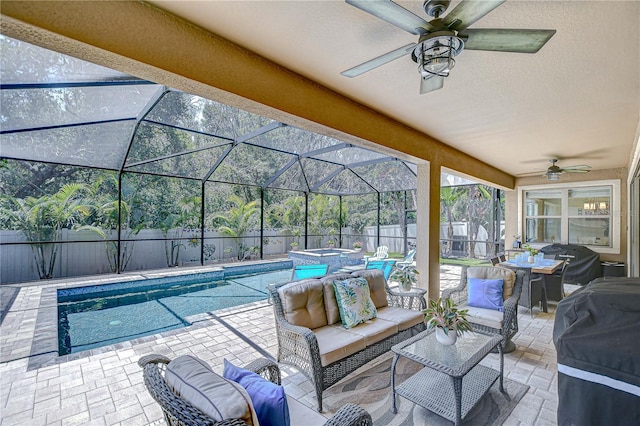 view of swimming pool featuring ceiling fan, a patio area, an outdoor hangout area, and a fenced backyard