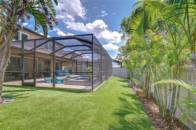 view of yard featuring a patio area, an outdoor pool, and glass enclosure