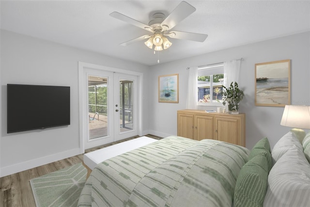 bedroom featuring access to exterior, french doors, wood finished floors, and baseboards